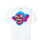 A white short-sleeve crewneck t-shirt featuring a large, vibrant graphic of a cartoon monkey face on the back. The graphic has bright blue hair, pink ears and mouth, yellow eyes, and a yellow-to-red gradient snout.